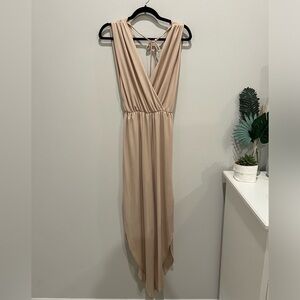 Adorable jumpsuit, low cut in front & back, size S
